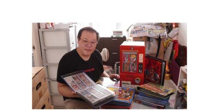Wilson Wong收藏了大量万变卡，单是手中这一本卡簿就值20万港元。