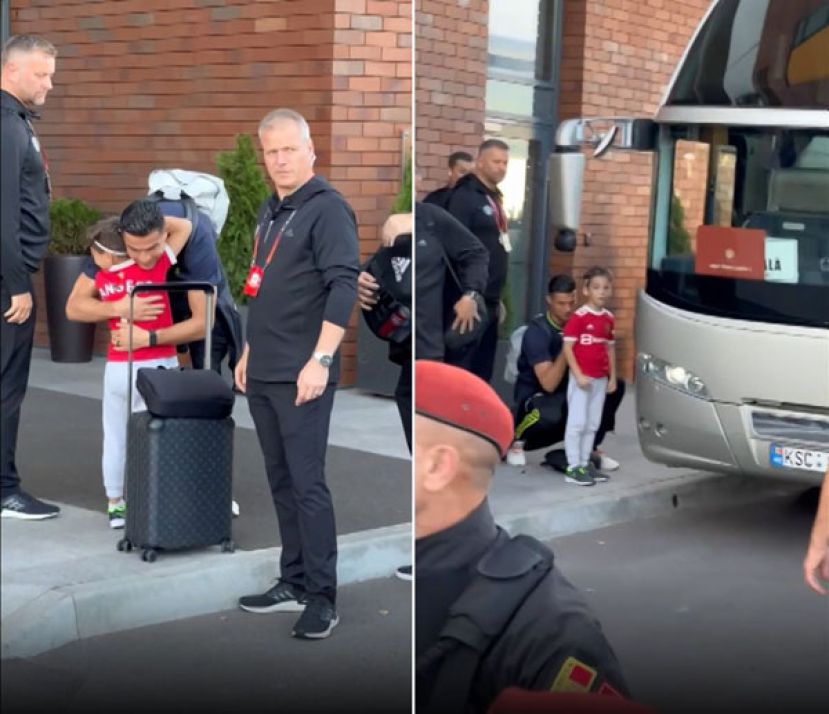 一名男童突破保镳防线，冲上前紧抱C罗。