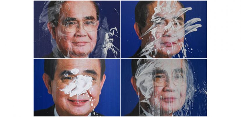 张贴在曼谷的泰国首相巴育竞选海报，于4月14日泼水节期间遭人以颜料涂抹。