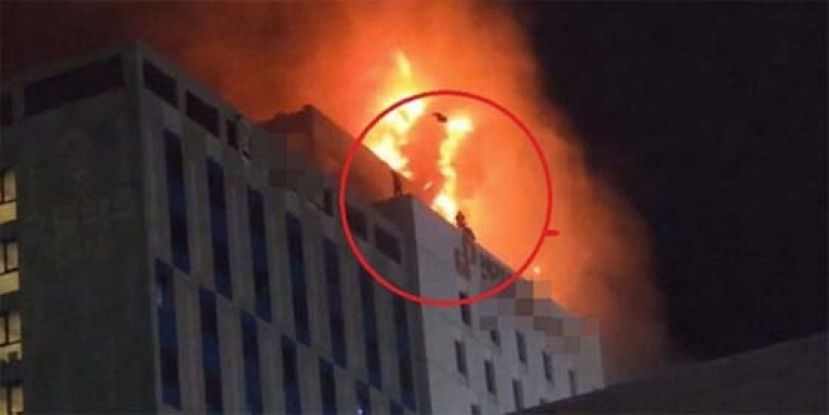 韩1酒店火灾54人伤，民众跳往别栋建筑物逃生。