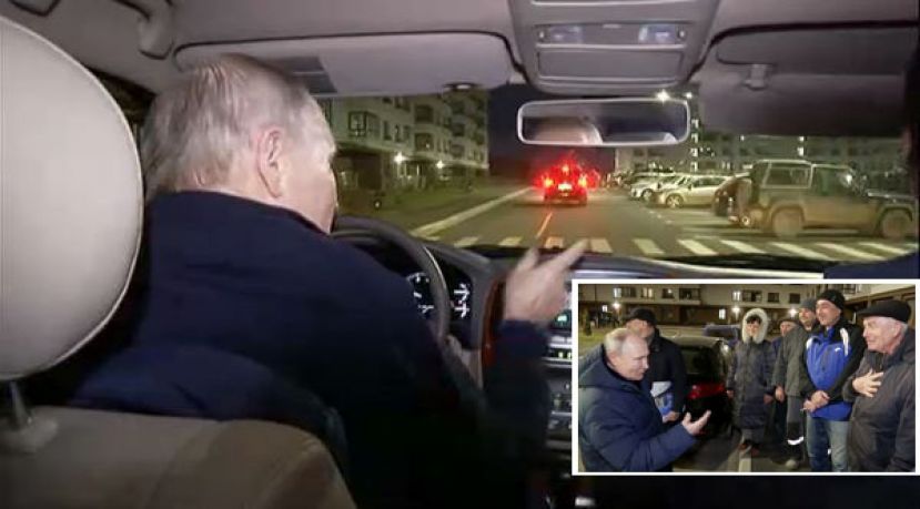 普京亲自开车行驶在马力波的街道上，并与当地居民谈话聊天。