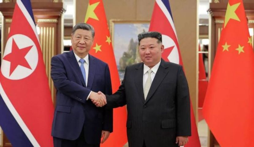 金正恩致贺习近平深化两国友好合作。
