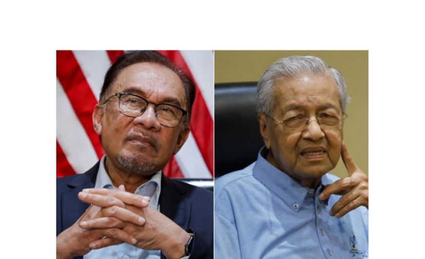 左为安华与马哈迪(右)。