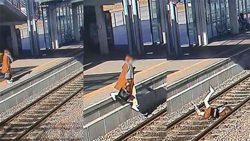 边等火车边讲电话，女子分心坠轨。