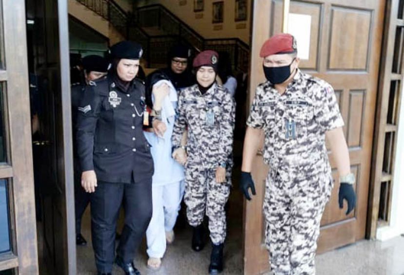 上诉人林咸慈被押离法庭。