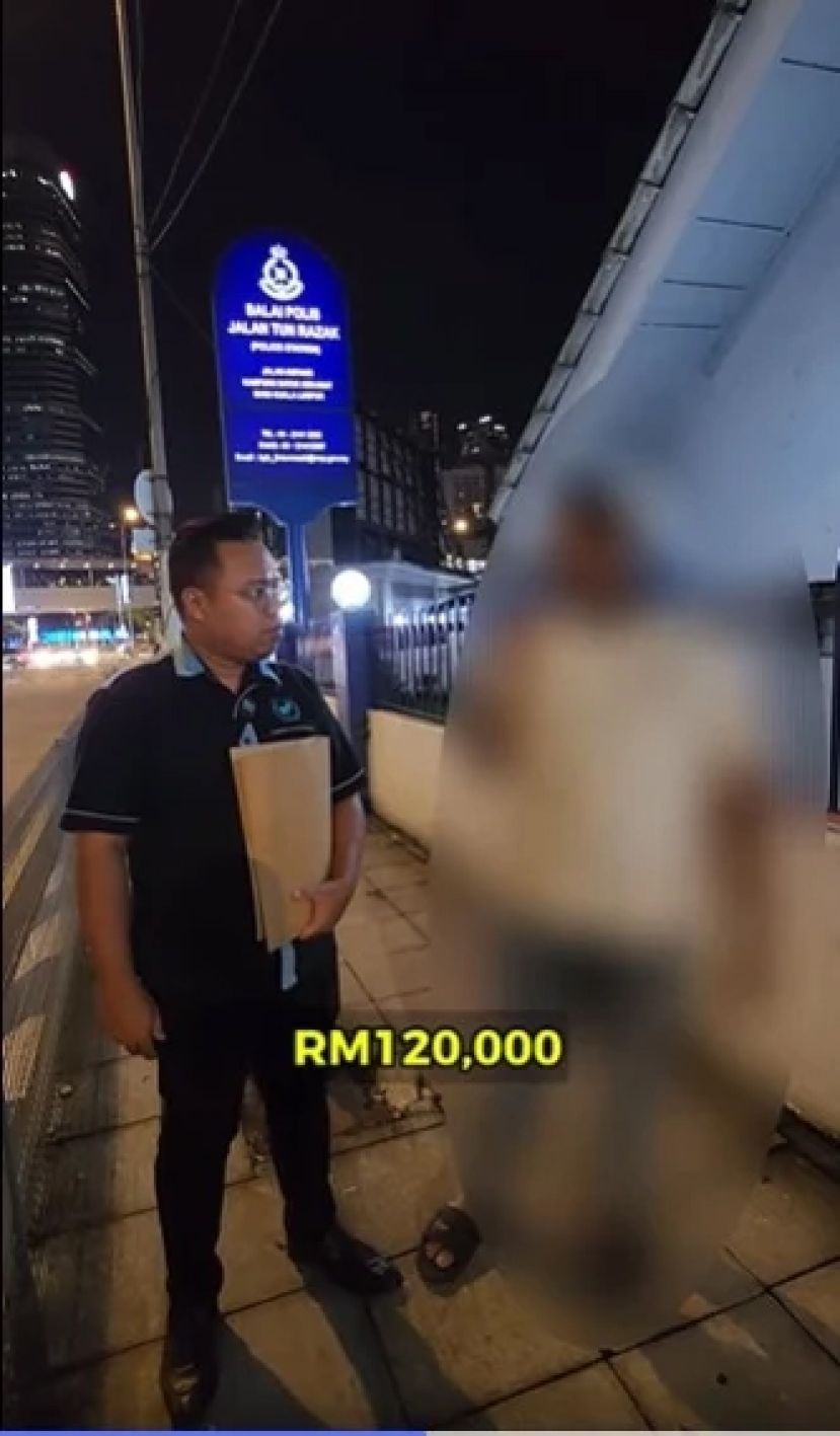 事主（右）在MHO代表陪同下到警局报案。