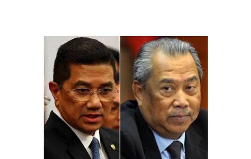 右为丹斯里慕尤丁，及拿督斯里阿兹敏（左）。